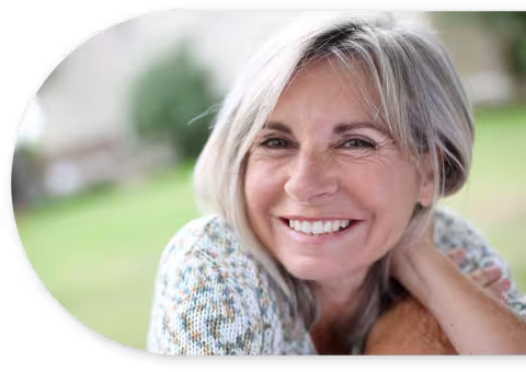Lady smiling with hand under her head